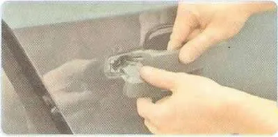 4. While holding the outside handle in the door opening position, loosen the lock plug mounting…