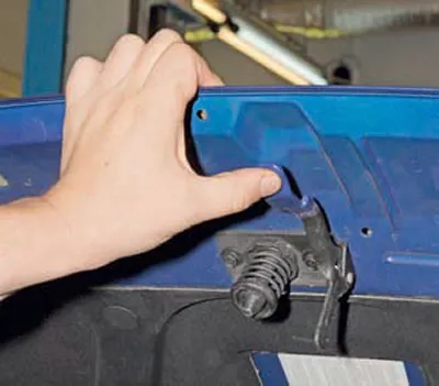 To open the hood, lift it by the front edge with one hand and press the safety hook lever, located…