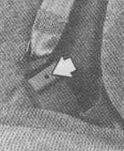 Before removing the seat, unfasten the passenger seat belts from the seat shell. To unfasten the…