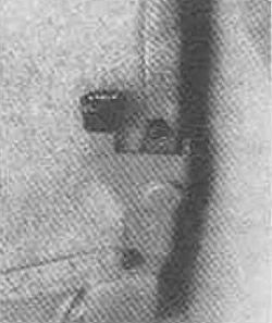 To remove the seat, open the rear cargo doors fully and enter the rear of the vehicle.